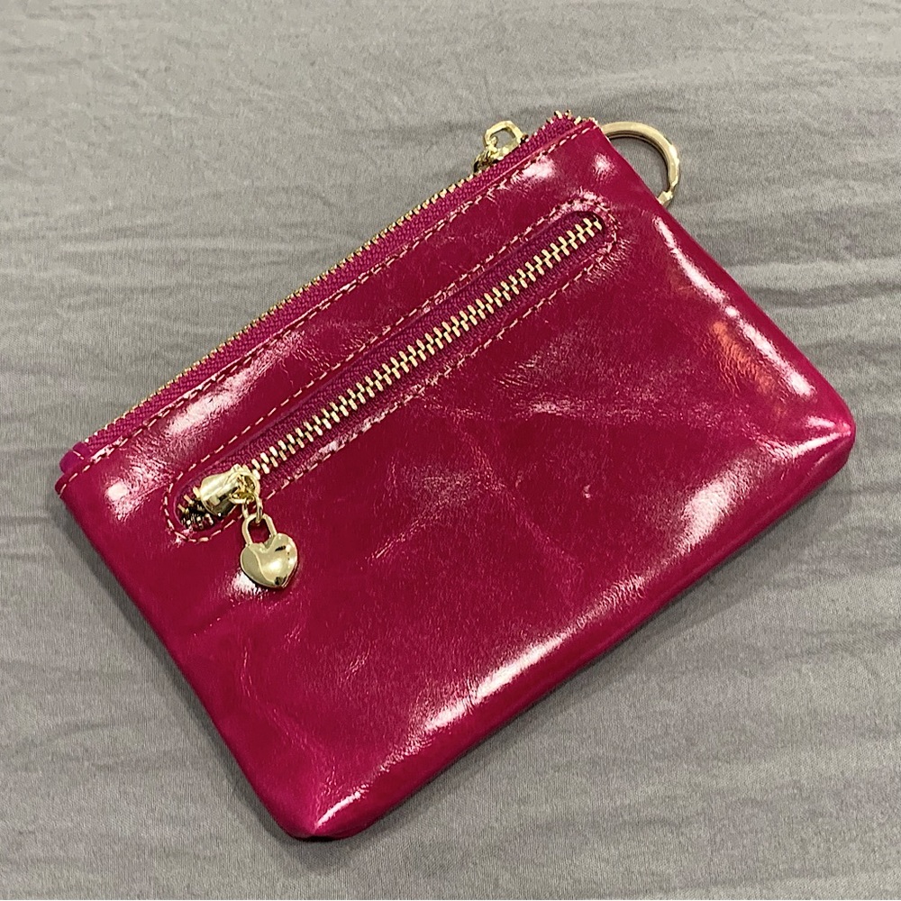 Brighton zipper wallet with key ring. Magenta w. gold zippers with heart charms